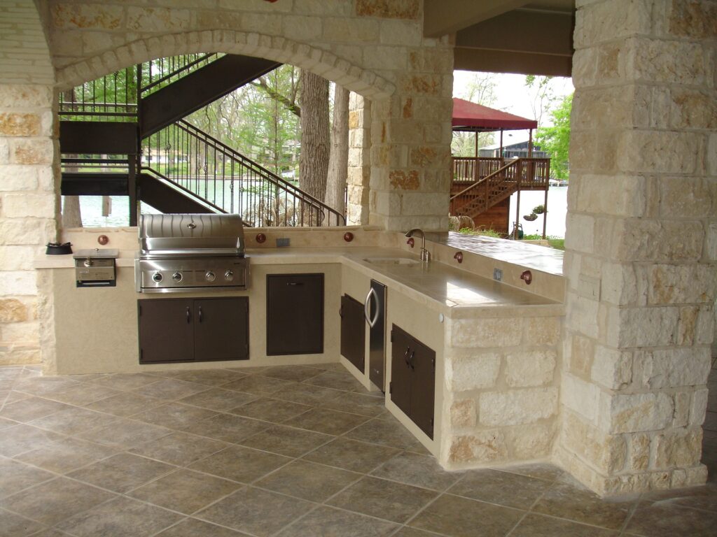 Outdoor kitchen, custom patio pavers, retaining walls, pool deck, wood deck